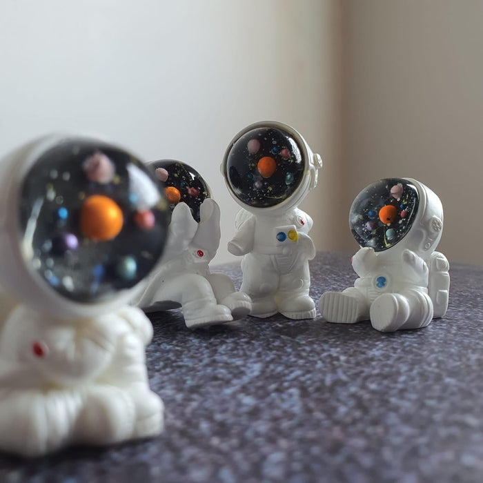 SATYAM KRAFT 1 Set Astronaut Miniature Set for Home, Bedroom, Living Room, Office, Restaurant Decor, Figurines and Christmas Decoration Items(Multicolor, Pack of 4) (Resin)